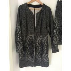 Rok en lang vest als set.