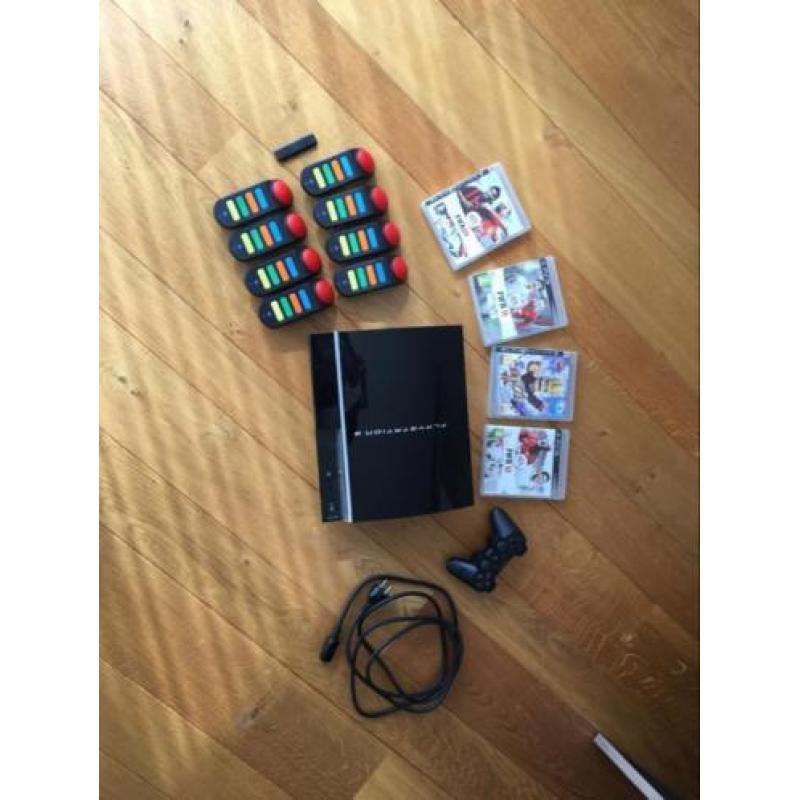 PlayStation 3 met spellen en controllers